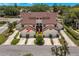 Aerial view of a three-unit townhouse building with attached garages at 3455 Countryside Blvd # 98, Clearwater, FL 33761