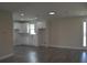 Modern kitchen featuring white cabinets, gray flooring, and stainless steel appliances at 3915 W Robson St, Tampa, FL 33614