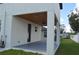 Covered patio with ceiling fan and gray flooring at 3915 W Robson St, Tampa, FL 33614