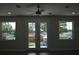 Bright living room with hardwood floors and French doors to balcony at 3915 W Robson St, Tampa, FL 33614