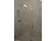 Modern shower with glass doors and gray marble-look tile at 3915 W Robson St, Tampa, FL 33614