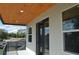 Modern balcony with wood ceilings, glass doors, and city views at 3915 W Robson St, Tampa, FL 33614
