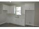 Modern kitchen with white shaker cabinets and quartz countertops at 3915 W Robson St, Tampa, FL 33614