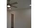 Bedroom with ceiling fan, closet, and gray vinyl flooring at 3915 W Robson St, Tampa, FL 33614