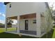Covered patio with ceiling fan and gray flooring at 3915 W Robson St, Tampa, FL 33614