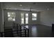 Spacious living room with hardwood floors and access to balcony at 3915 W Robson St, Tampa, FL 33614