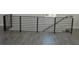 Modern staircase with metal railing and hardwood floors at 3915 W Robson St, Tampa, FL 33614