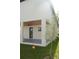 Covered patio with ceiling fan and gray flooring at 3915 W Robson St, Tampa, FL 33614