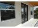 Modern balcony with glass doors and window showcasing the neighborhood at 3915 W Robson St, Tampa, FL 33614