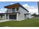 Modern two-story home with attached garage and balcony at 3915 W Robson St, Tampa, FL 33614
