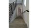 Modern staircase with metal railing leading to the upper level at 3915 W Robson St, Tampa, FL 33614