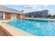 Inviting community pool with surrounding lounge chairs at 3970 37Th S St # 14, St Petersburg, FL 33711