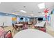 Bright and spacious community room with tables and chairs at 3970 37Th S St # 14, St Petersburg, FL 33711