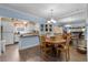 Spacious dining area with kitchen access, wooden table and chairs at 3970 37Th S St # 14, St Petersburg, FL 33711