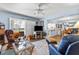 Spacious living room featuring fireplace, comfy seating, and access to patio at 3970 37Th S St # 14, St Petersburg, FL 33711
