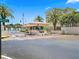 Gated entrance to a waterfront community, with palm trees and a guardhouse at 7600 Sun Island S Dr # 107, South Pasadena, FL 33707