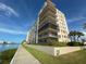 Waterfront building with walkway, landscaping and multiple balconies at 7600 Sun Island S Dr # 107, South Pasadena, FL 33707