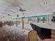 Ballroom with a stage and beautiful hardwood floor at 7600 Sun Island S Dr # 107, South Pasadena, FL 33707