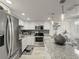 Well-equipped kitchen features stainless steel appliances and mosaic tile backsplash at 7600 Sun Island S Dr # 107, South Pasadena, FL 33707