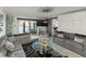 Comfortable living room with water views and sliding glass doors leading to outdoor patio at 7600 Sun Island S Dr # 107, South Pasadena, FL 33707