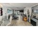 Spacious living room with water view, sectional sofa, and modern decor at 7600 Sun Island S Dr # 107, South Pasadena, FL 33707