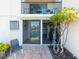 Outdoor patio features a view to the water and surrounding landscaping at 7600 Sun Island S Dr # 107, South Pasadena, FL 33707