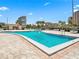Enjoy a refreshing swim in this beautiful outdoor pool surrounded by palm trees at 7600 Sun Island S Dr # 107, South Pasadena, FL 33707