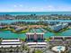An aerial view of a waterfront community with lush landscaping and a marina at 7600 Sun Island S Dr # 107, South Pasadena, FL 33707
