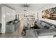 Spacious living room with gray sectional sofa and modern decor at 7600 Sun Island S Dr # 107, South Pasadena, FL 33707