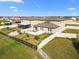 Aerial view showing the neighborhood and lagoon at 8968 Parsons Hill Blvd, Wesley Chapel, FL 33545