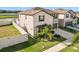 Two story house with a fenced backyard and palm tree at 8968 Parsons Hill Blvd, Wesley Chapel, FL 33545