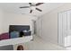 Bedroom with suitcases and built-in storage at 8968 Parsons Hill Blvd, Wesley Chapel, FL 33545