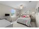 Bedroom with bed, desk, and window at 8968 Parsons Hill Blvd, Wesley Chapel, FL 33545