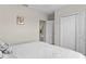Comfortable bedroom with white bedding and built-in closet at 8968 Parsons Hill Blvd, Wesley Chapel, FL 33545