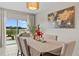 Bright dining room with sliding glass doors leading to the backyard at 8968 Parsons Hill Blvd, Wesley Chapel, FL 33545