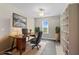 Home office features built-in shelving and a large desk at 8968 Parsons Hill Blvd, Wesley Chapel, FL 33545