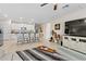 Open kitchen with island, white cabinets, and granite countertops at 8968 Parsons Hill Blvd, Wesley Chapel, FL 33545