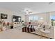 Spacious living room with sectional sofa and large windows at 8968 Parsons Hill Blvd, Wesley Chapel, FL 33545