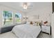 Main bedroom with a king-size bed and stylish decor at 8968 Parsons Hill Blvd, Wesley Chapel, FL 33545