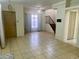 Entryway with tile floors and staircase at 2 Emerald Bay Dr, Oldsmar, FL 34677