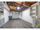 Spacious garage with ample storage shelving and a large overhead door at 17444 2Nd E St, Redington Shores, FL 33708