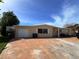 House exterior with brick driveway and garage at 17444 2Nd E St, Redington Shores, FL 33708