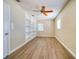 Spacious bedroom with built-in shelving and hardwood floors at 17444 2Nd E St, Redington Shores, FL 33708