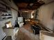 Unfinished garage with discarded bathroom fixtures and appliances at 17444 2Nd E St, Redington Shores, FL 33708