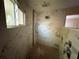 Walk-in shower with marble tile, pebble floor, and built-in seating at 17444 2Nd E St, Redington Shores, FL 33708