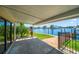 Covered patio overlooking the water with access to the backyard at 17444 2Nd E St, Redington Shores, FL 33708