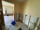 Bathroom under renovation with exposed plumbing and flooring at 17444 2Nd E St, Redington Shores, FL 33708