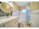 Clean bathroom with white tile and bathtub shower at 17444 2Nd E St, Redington Shores, FL 33708