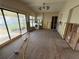 Living room undergoing renovation with new floors at 17444 2Nd E St, Redington Shores, FL 33708