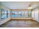 Living room with large windows and water views at 17444 2Nd E St, Redington Shores, FL 33708